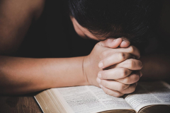 Christian life crisis prayer to god. Woman Pray for god blessing to wishing have a better life. woman hands praying to god with the bible. begging for forgiveness and believe in goodness.